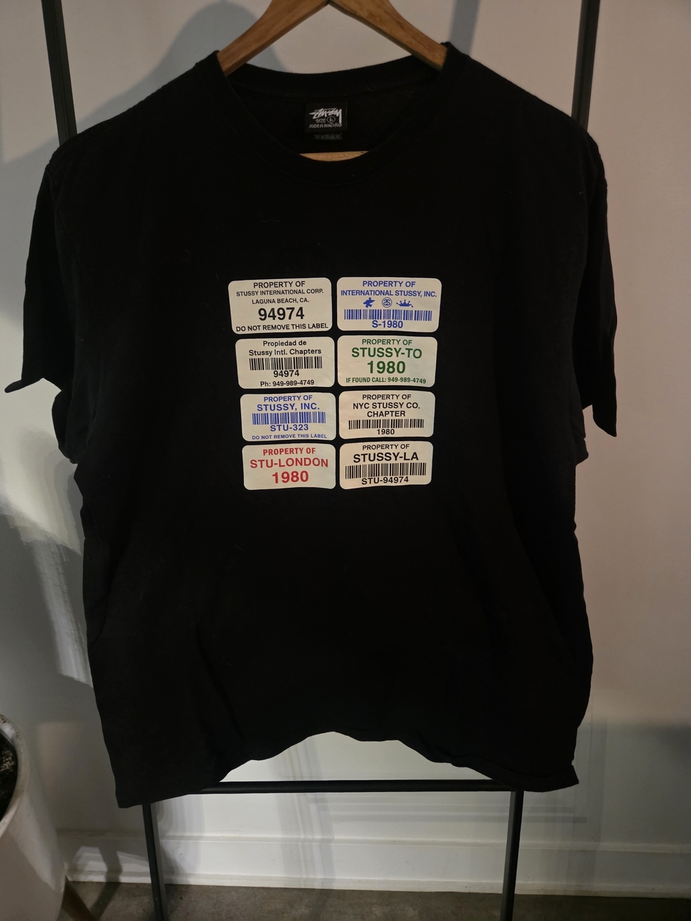 Stussy Black Short Sleeve Tee with Multi-Label Graphic